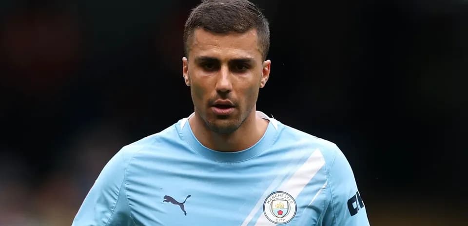 Player wearing Manchester City training kit on pitch