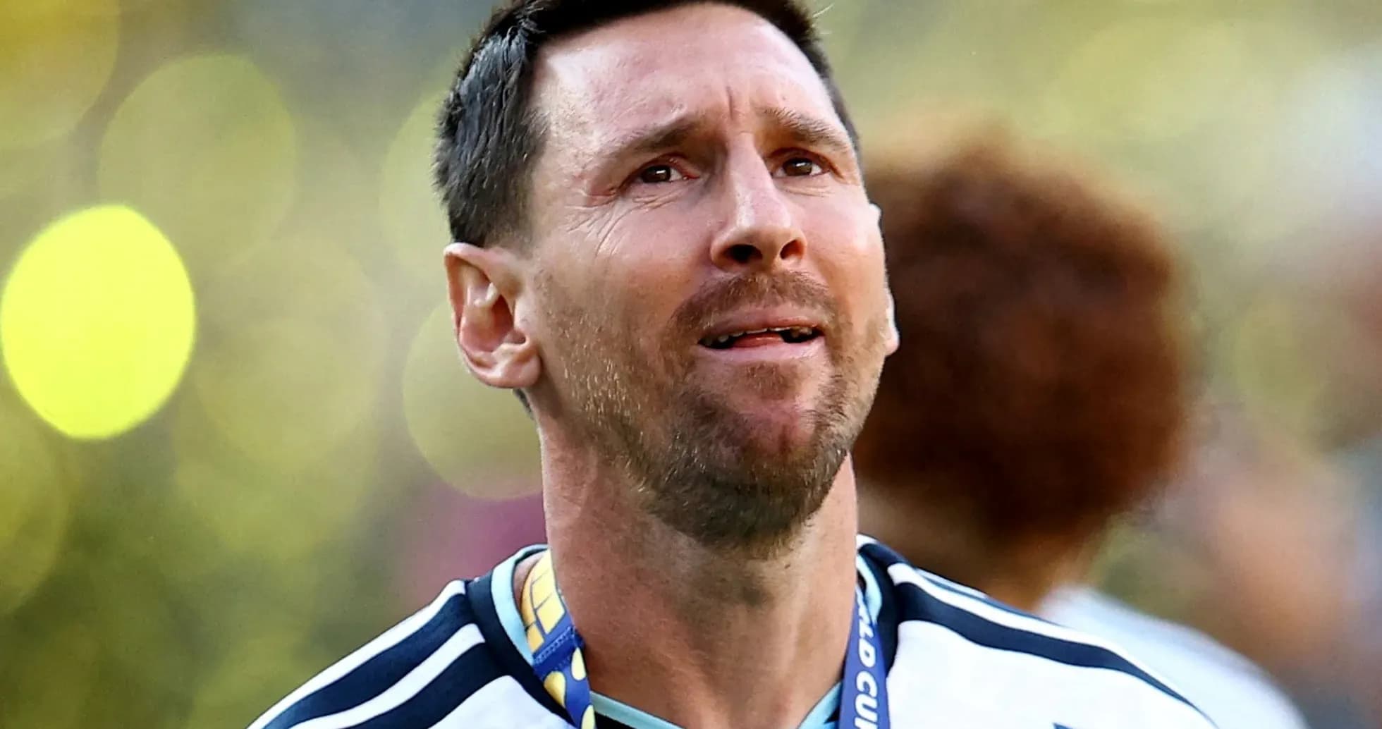 Player wearing Argentina jersey with medal around neck