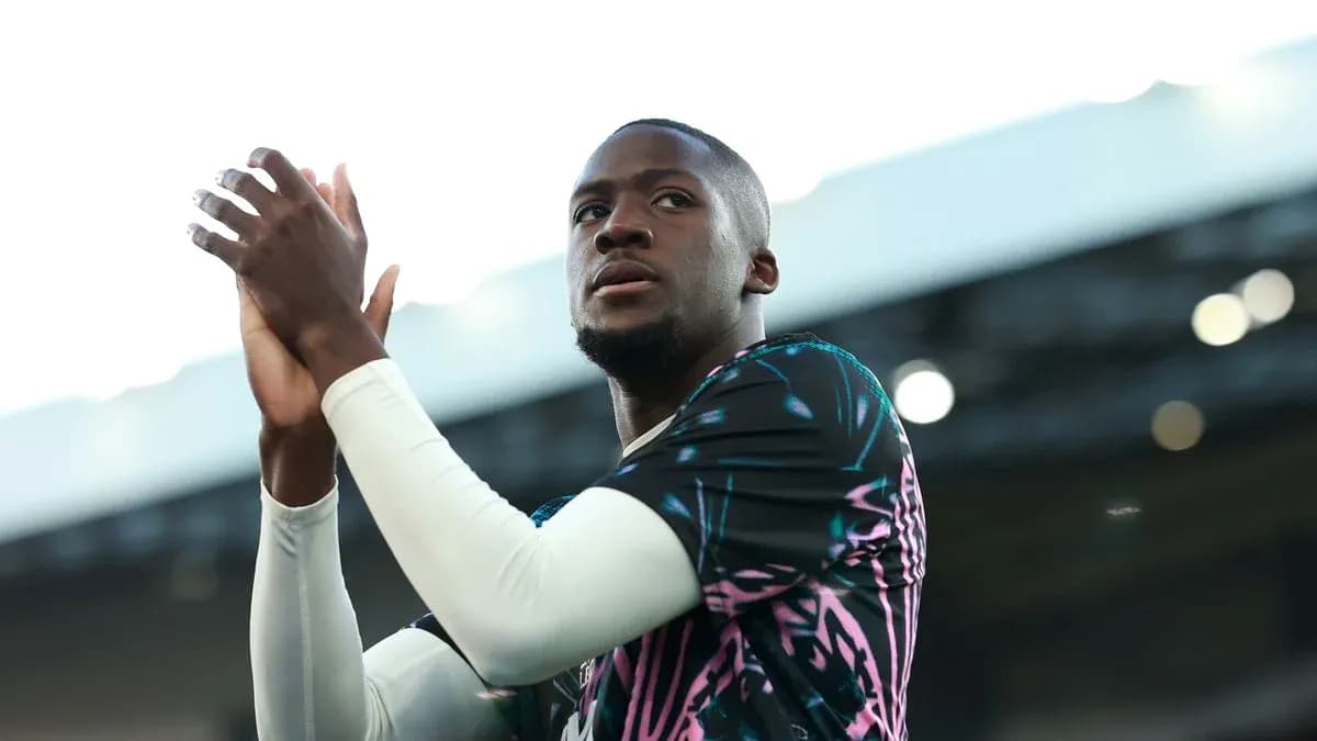 Player clapping during match warm-up on pitch