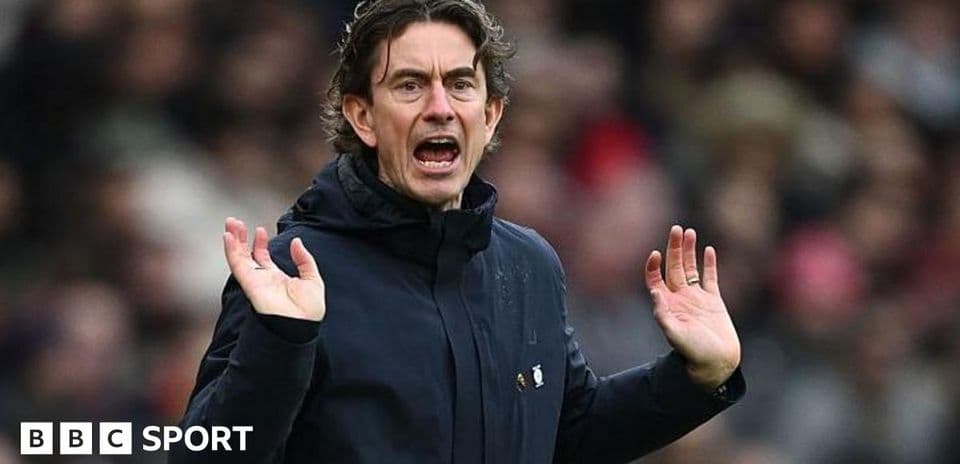 Manager gesturing on the sidelines during match