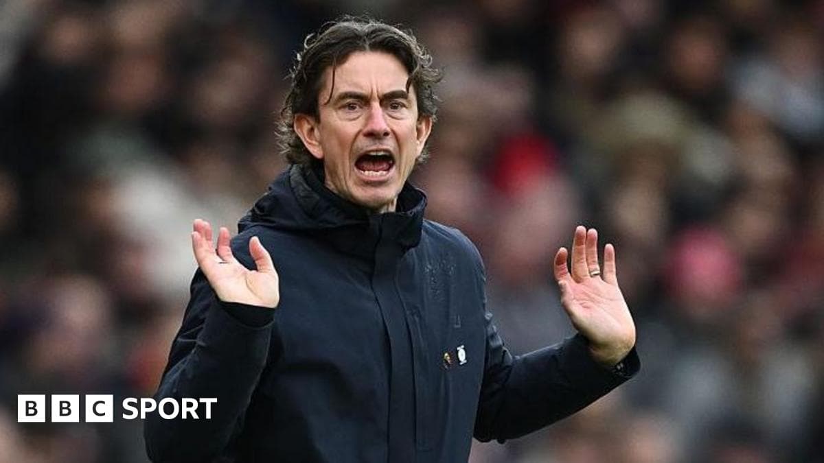 Manager gesturing on the sidelines during match