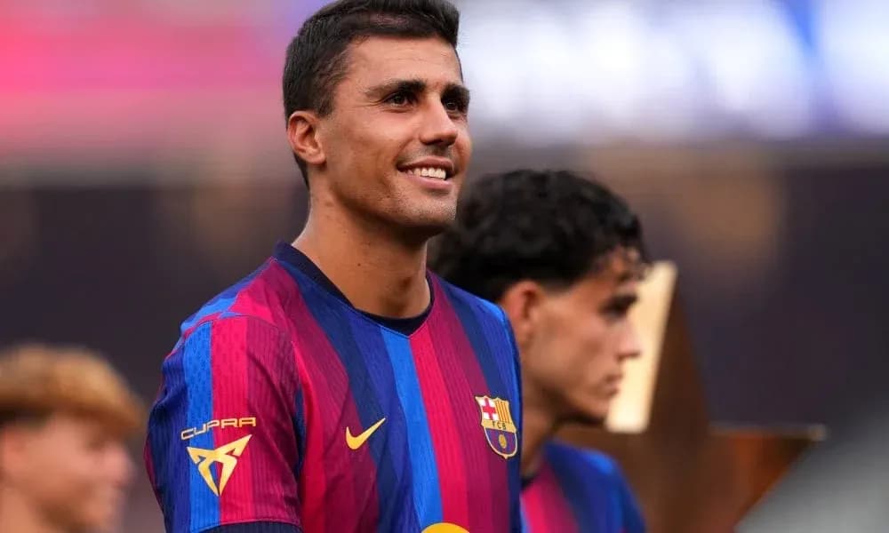 Player smiling during celebration with teammates