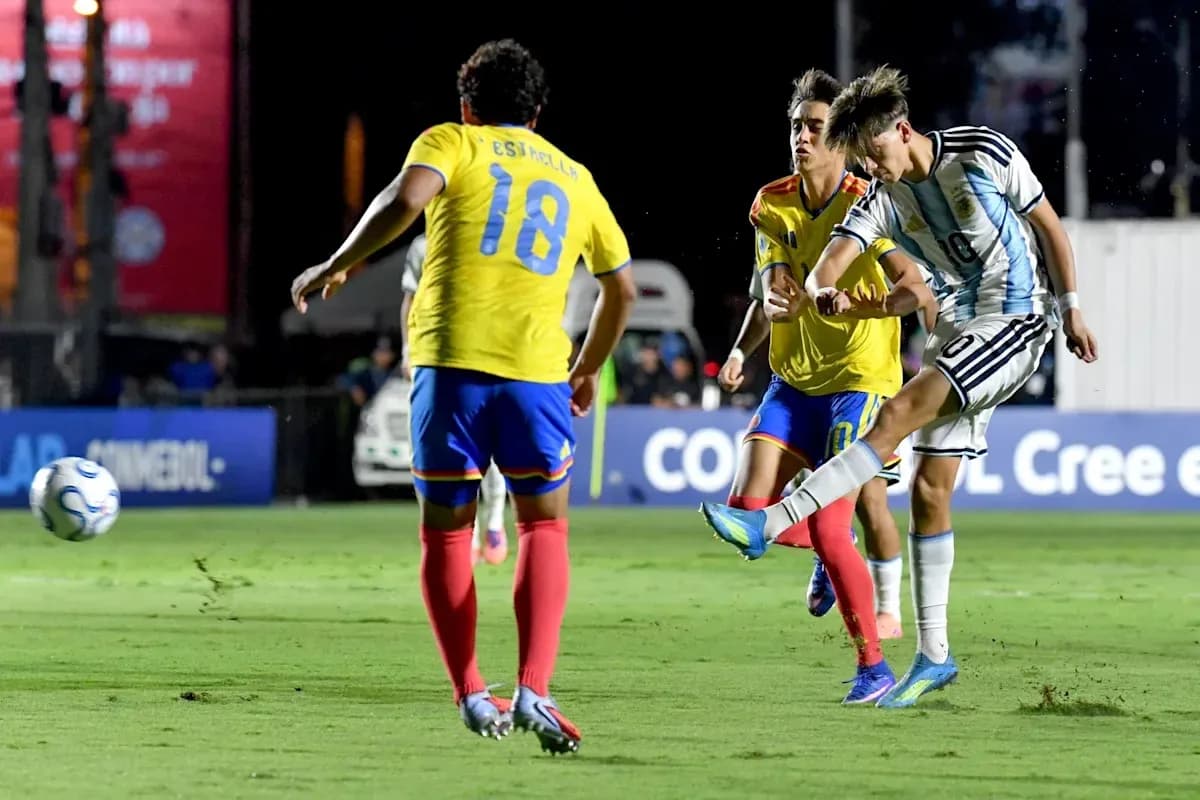 Argentinian player shooting while defenders approach