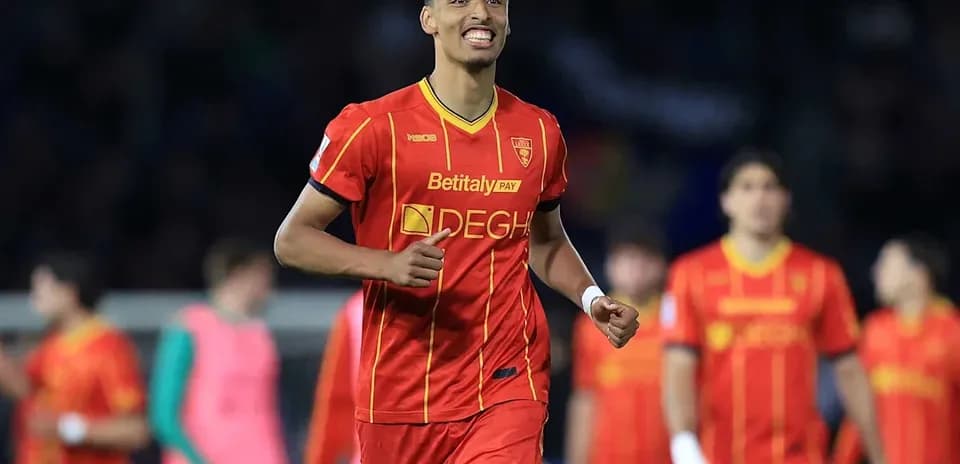 Player celebrating a goal in red team uniform