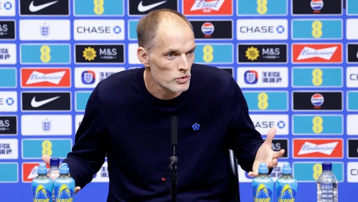 Manager speaking at press conference with backdrop