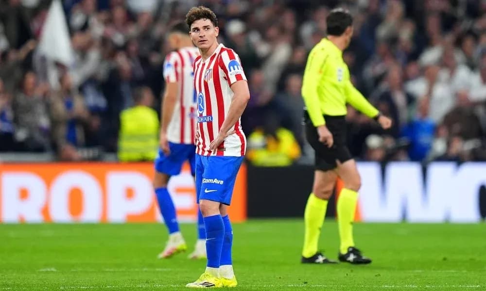 Atletico Madrid player looking concerned during match