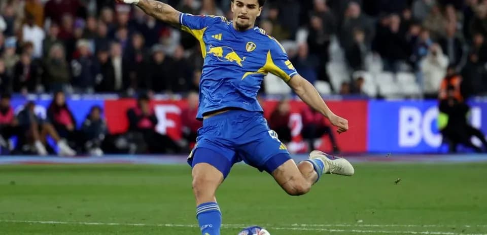 Player striking the ball during a football match