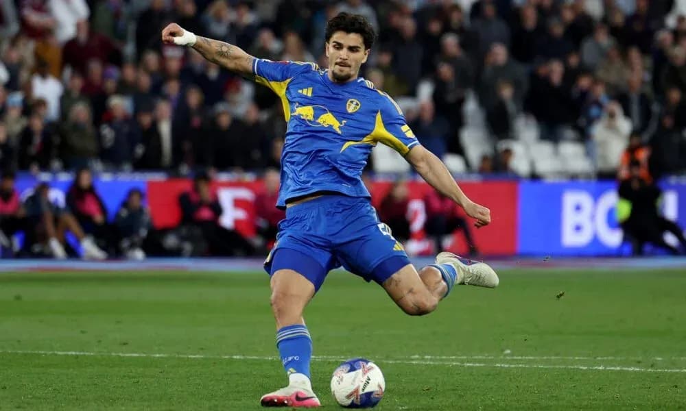 Player striking the ball during a football match