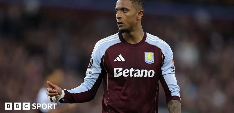 Aston Villa player gesturing during match action
