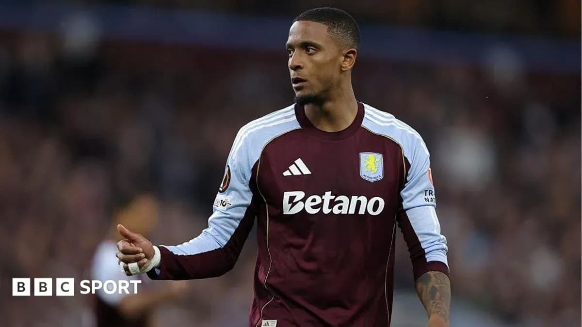 Aston Villa player gesturing during match action
