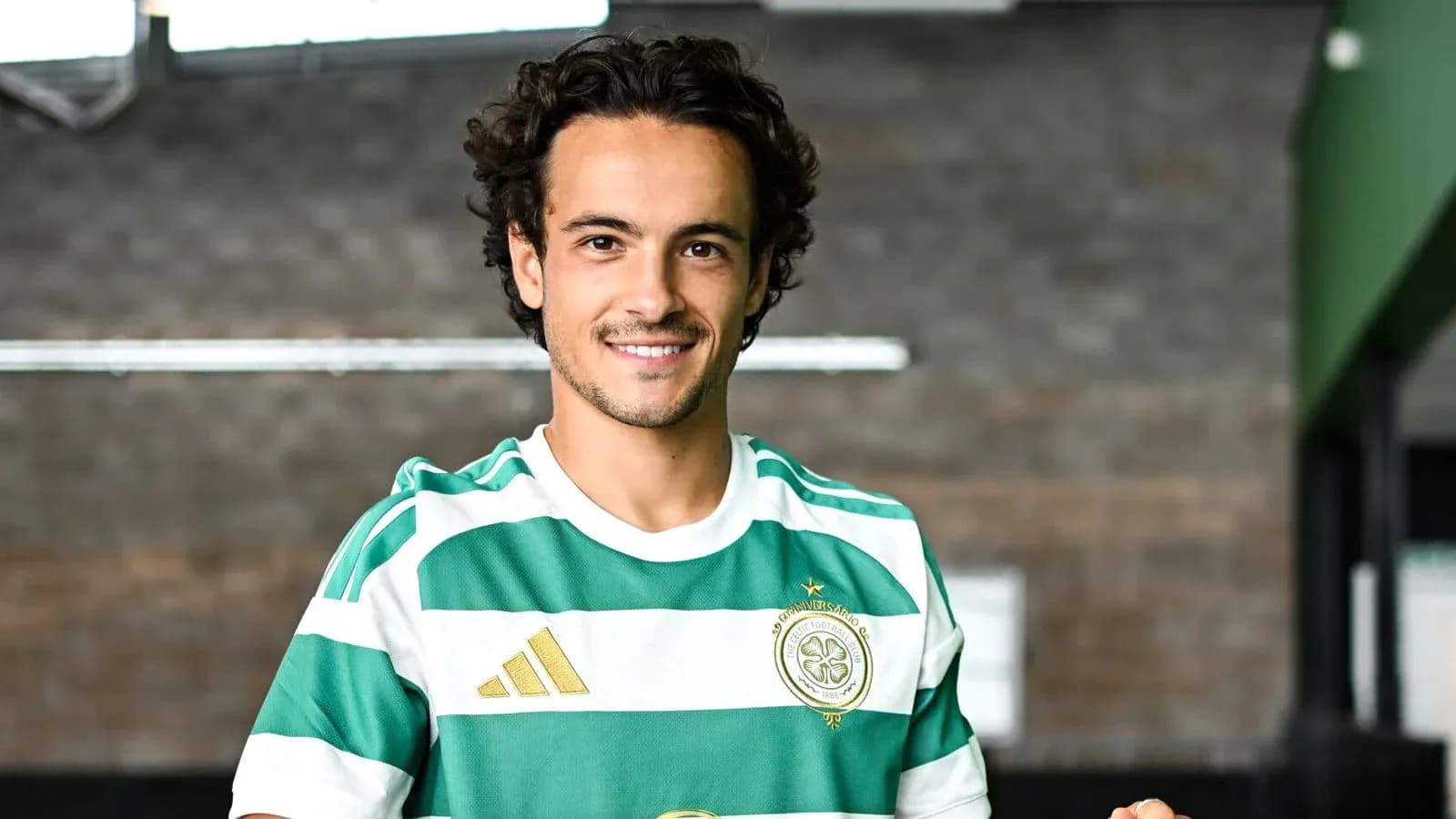 Player posing in green and white striped jersey