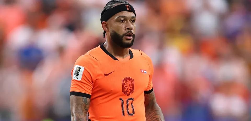 Player in orange jersey during football match