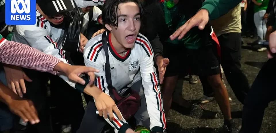 Fans celebrating during a sports event at night