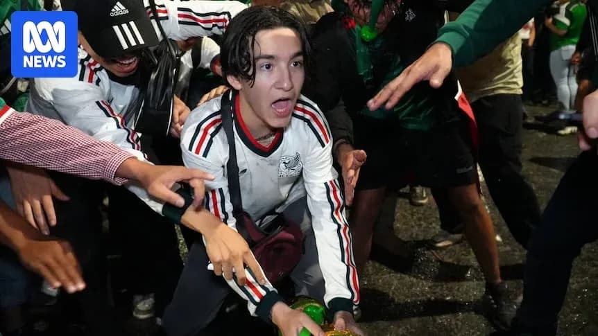Fans celebrating during a sports event at night Fans celebrating during a sports event at night
