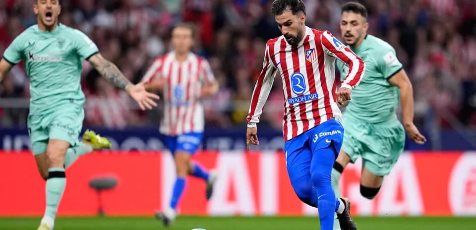 Atletico Madrid player dribbling during match