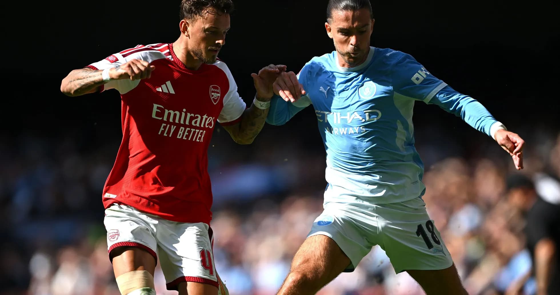 Two players battling for the ball during match