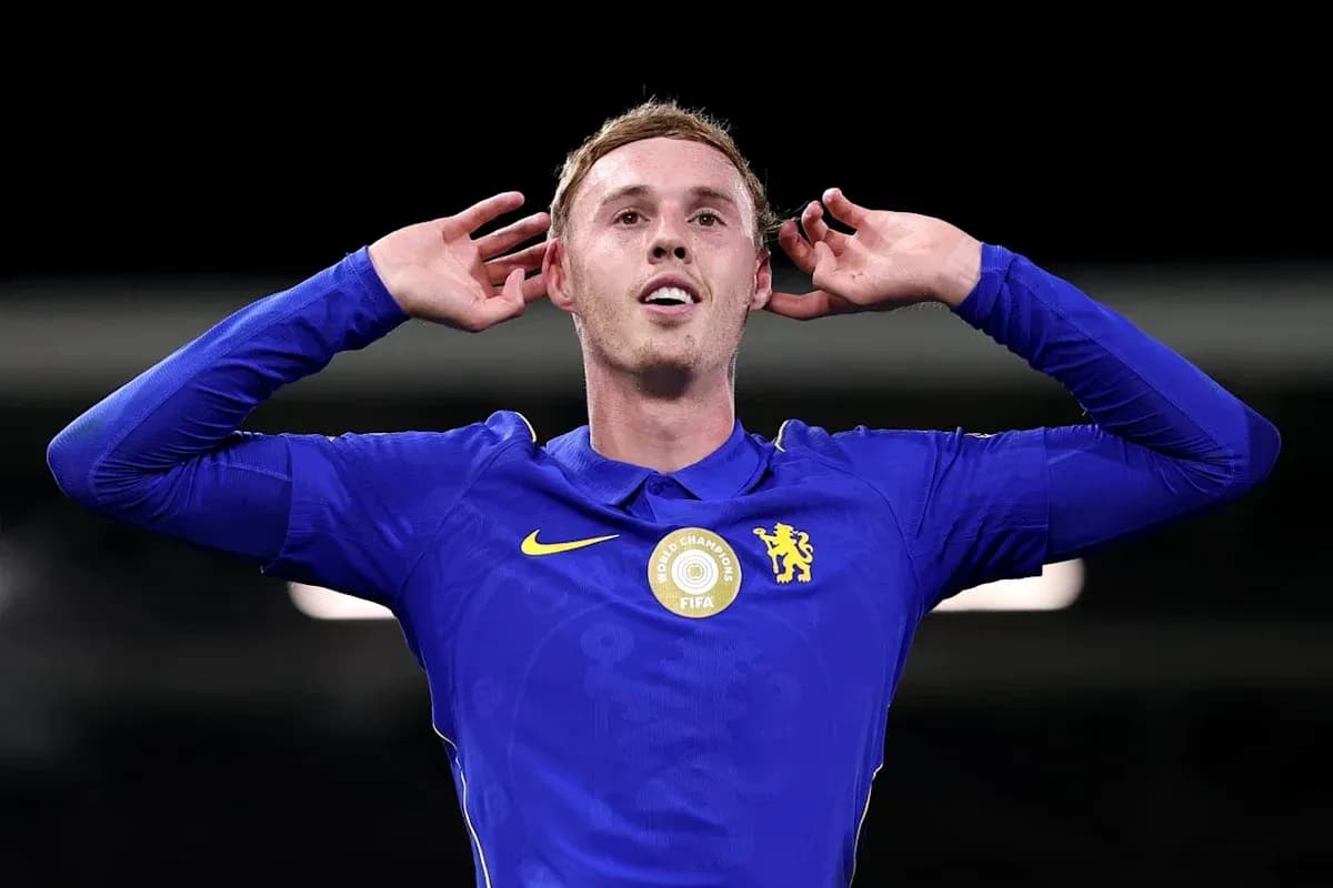 Player celebrating with hands on ears after scoring