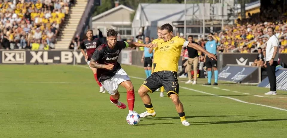 Lincoln Red Imps player dribbling against Mjallby AIF