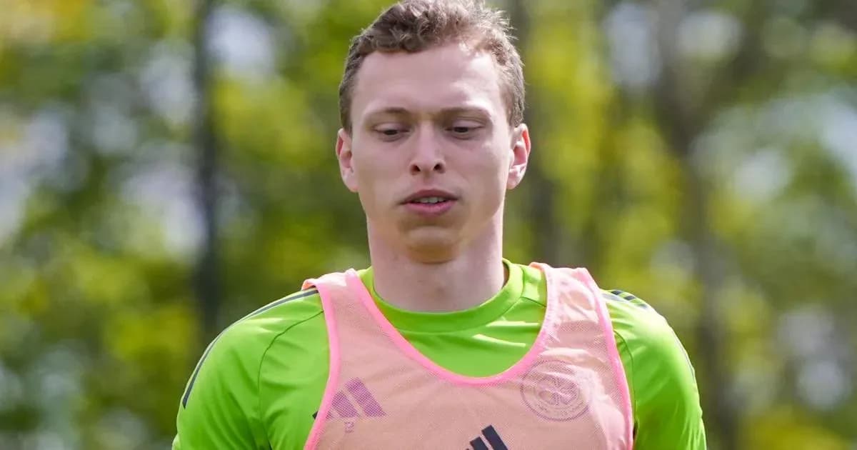 Goalkeeper training in green kit and pink vest