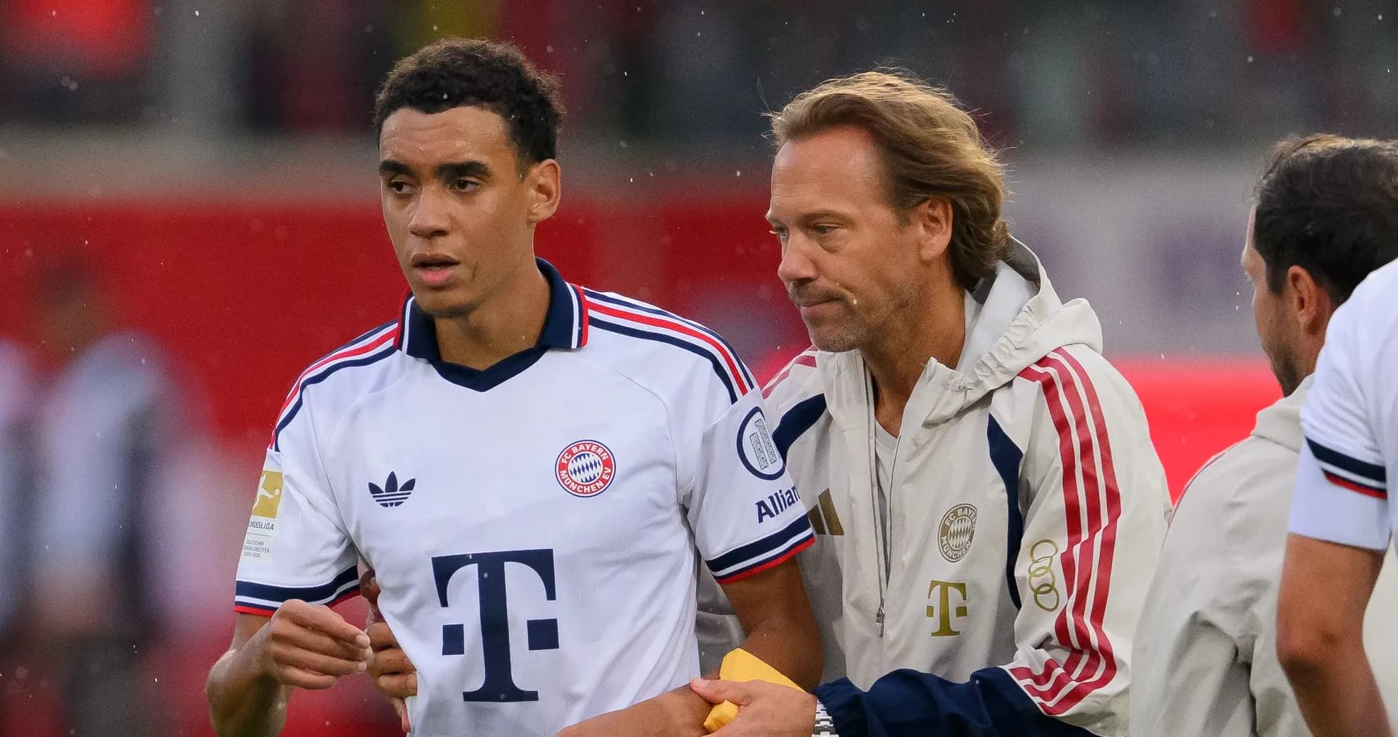 Player receiving instructions from coach during match