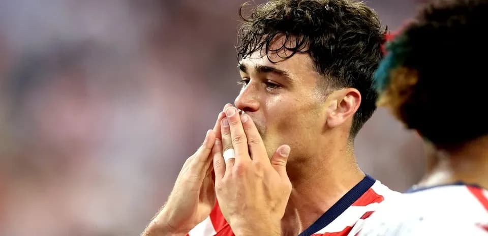 Player celebrating with hands near mouth after match