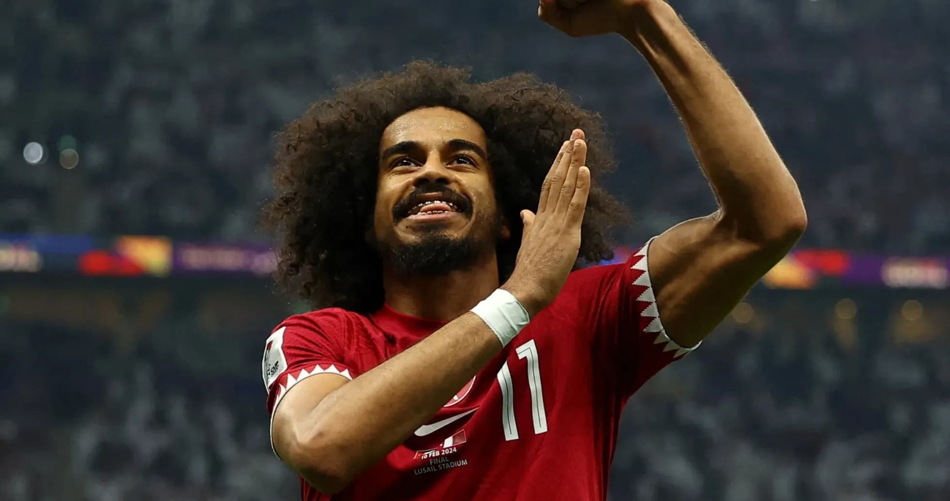 Qatari player celebrating during football match