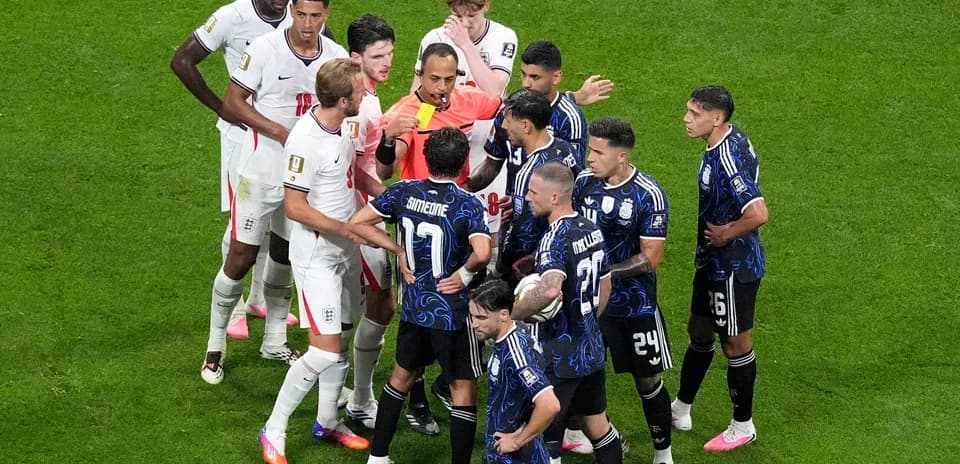 England and Argentina players arguing with referee