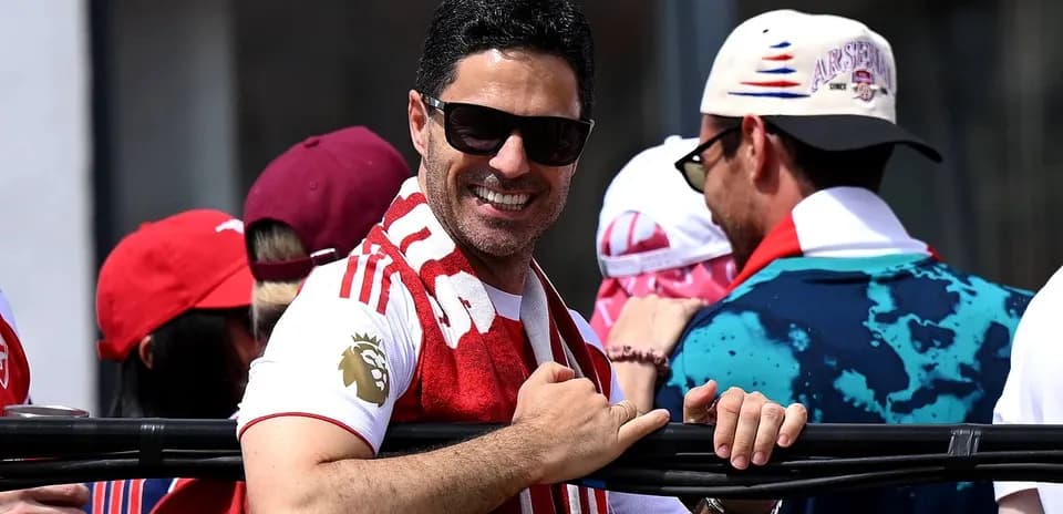 Man in sunglasses smiling at a celebration event