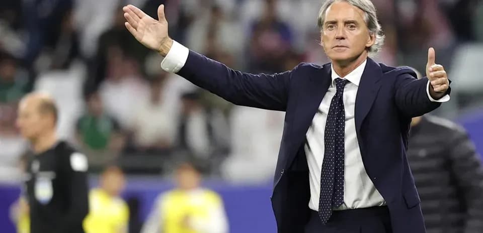 Manager gesturing during a football match