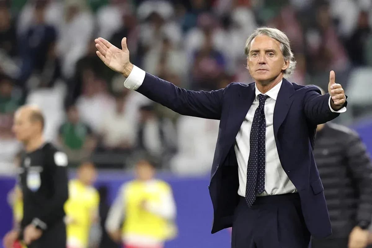 Manager gesturing during a football match