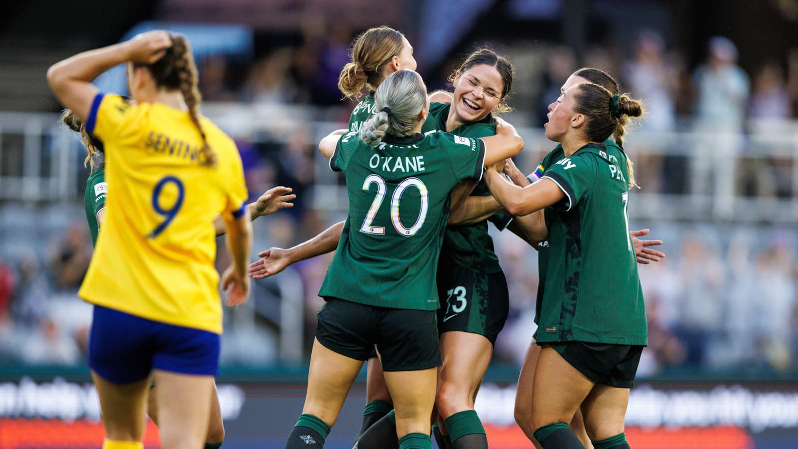Players celebrating a goal during match
