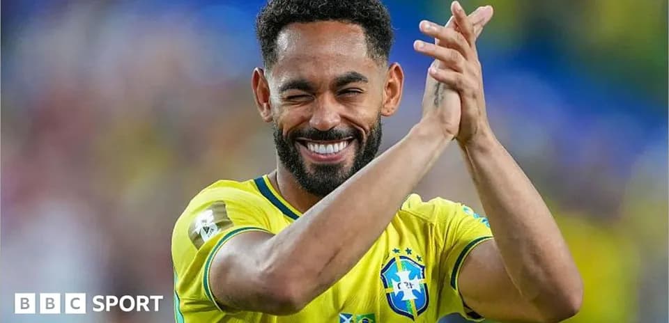 Player celebrating and clapping in Brazil jersey