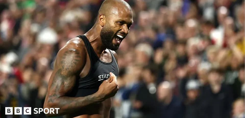 Athlete celebrating with fans in the background