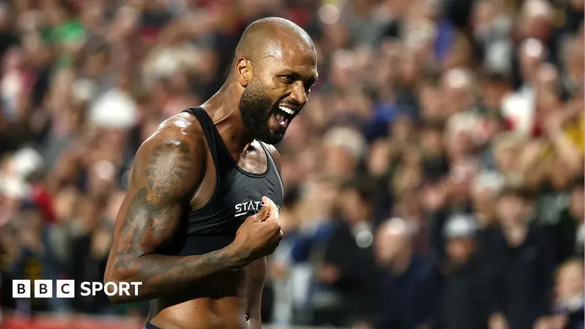 Athlete celebrating with fans in the background