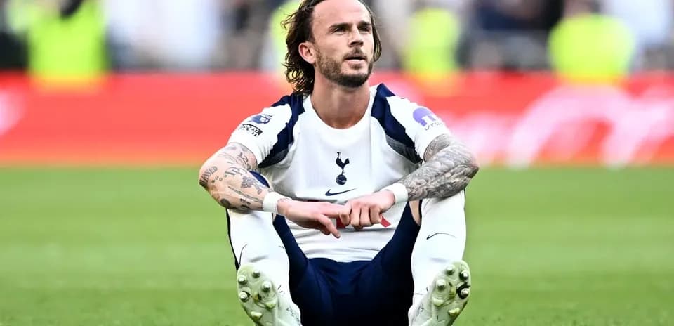Tottenham player sitting on the pitch after match