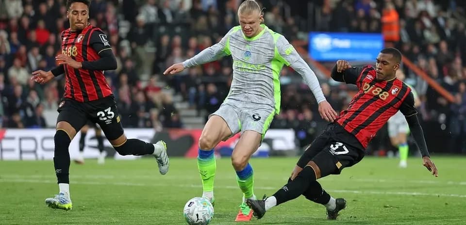 Erling Haaland dribbling past Bournemouth defenders