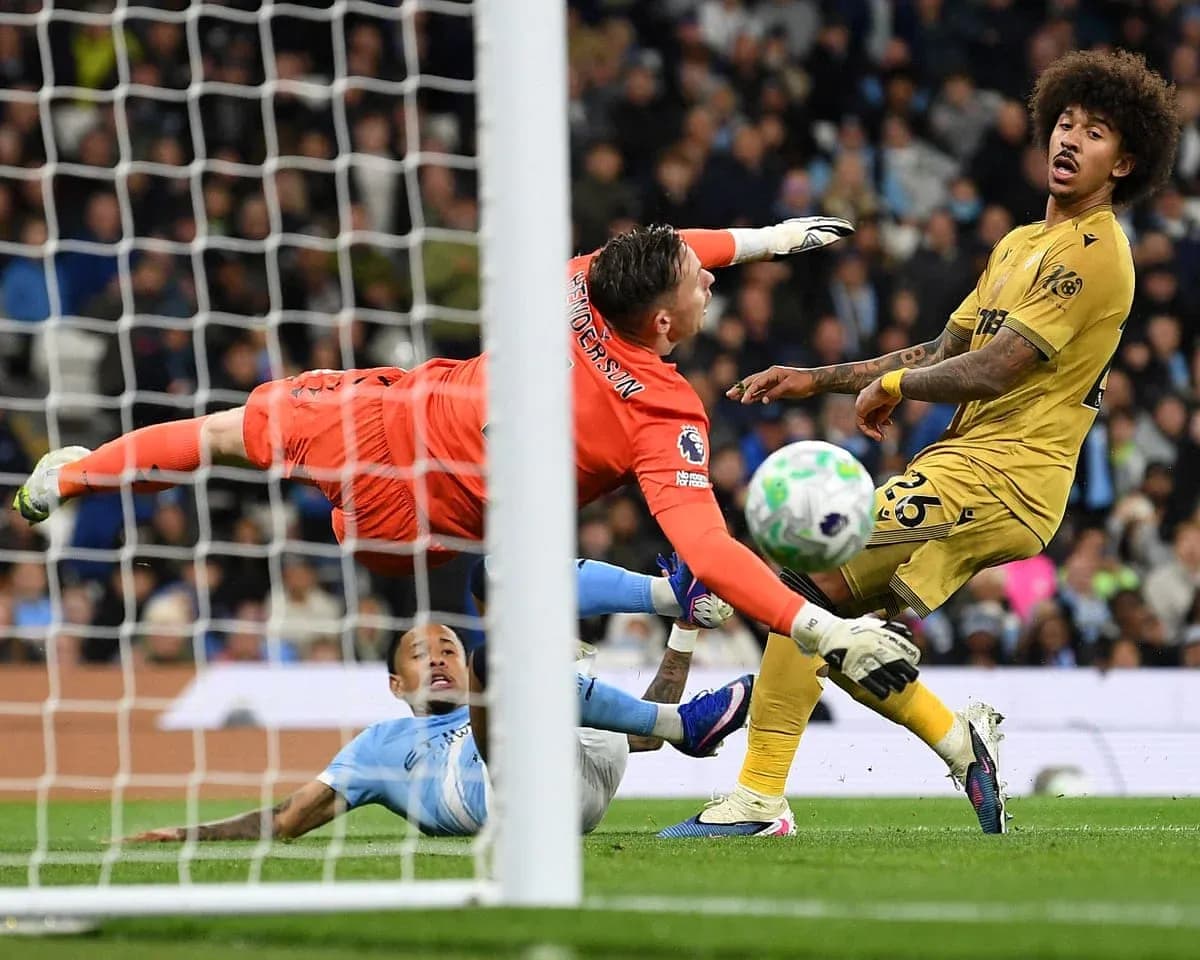 Goalkeeper diving to save shot during match