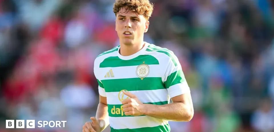 Player in Celtic kit running on the pitch