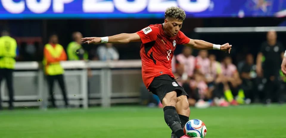 Player kicking the ball during match action
