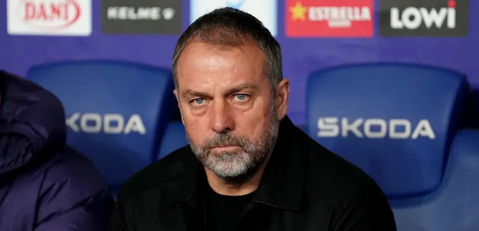 Coach sitting on bench during match