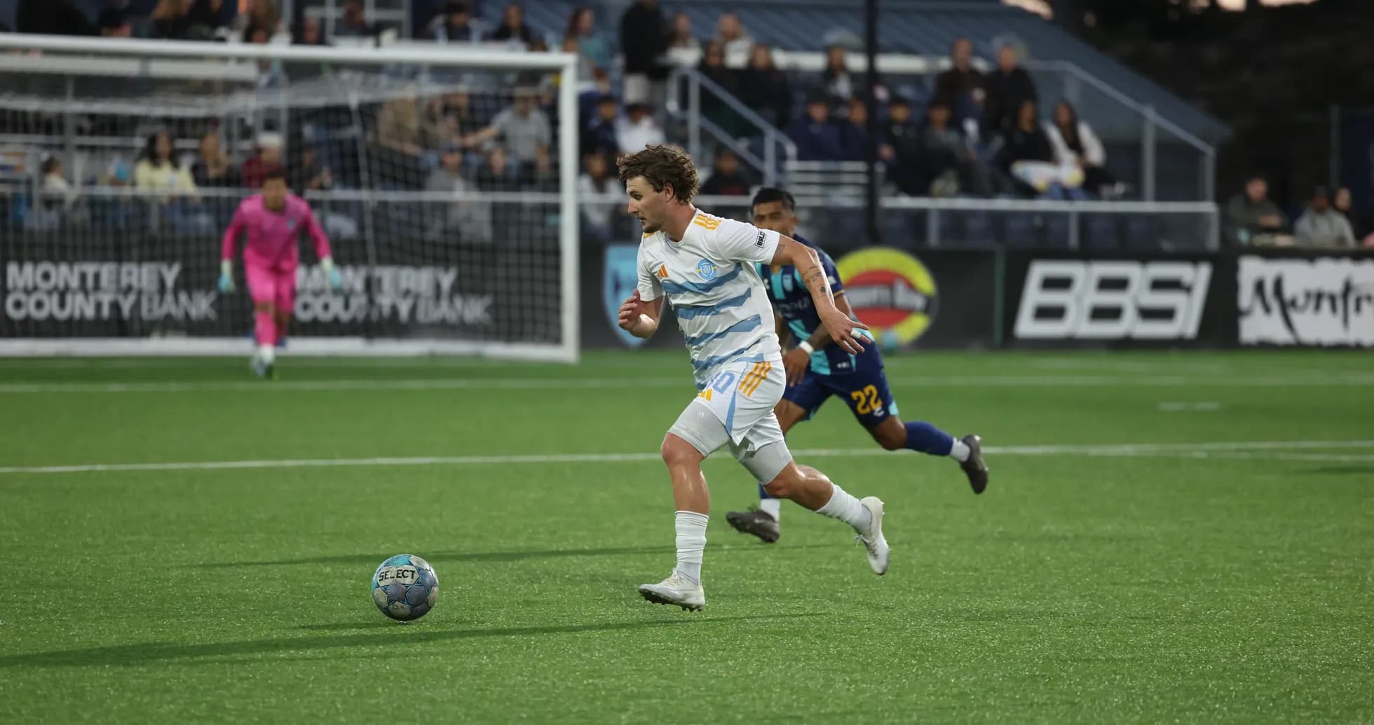 Monterey Bay player chasing the ball during match