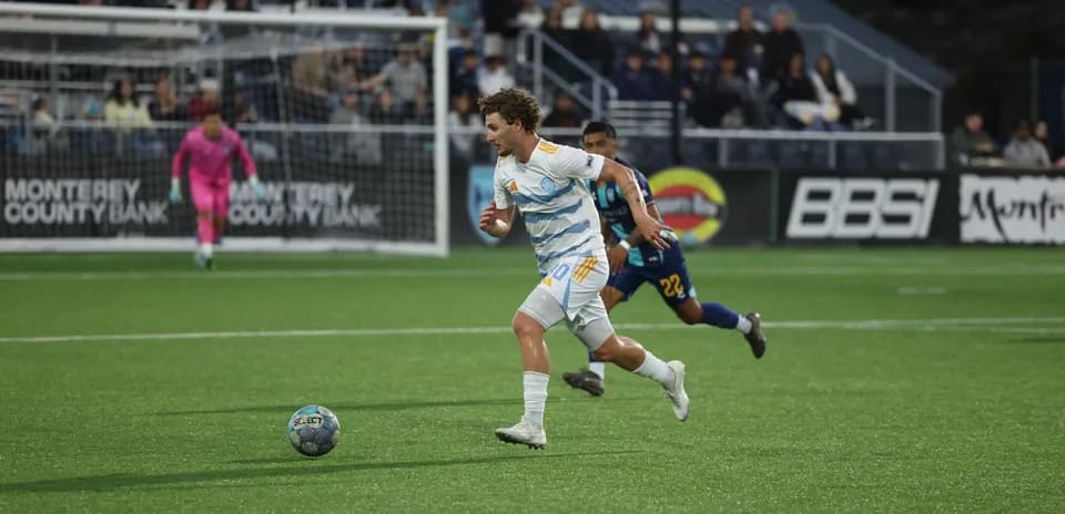 Monterey Bay player chasing the ball during match