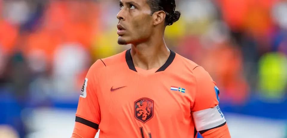 Player in orange jersey during football match