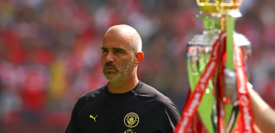 Manager observing trophy presentation at stadium