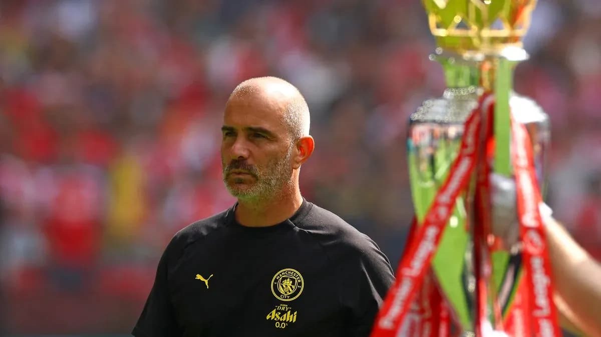 Manager observing trophy presentation at stadium