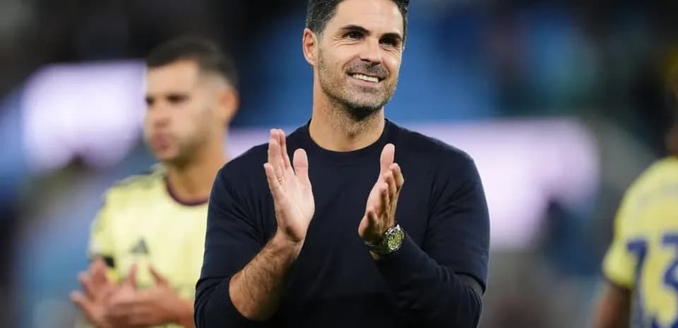 Coach clapping during post-match appreciation