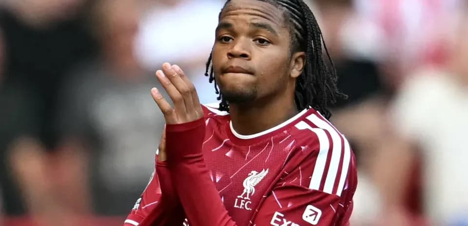 Player in Liverpool jersey clapping to the crowd