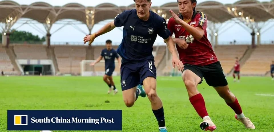 Player tackling opponent during a soccer match