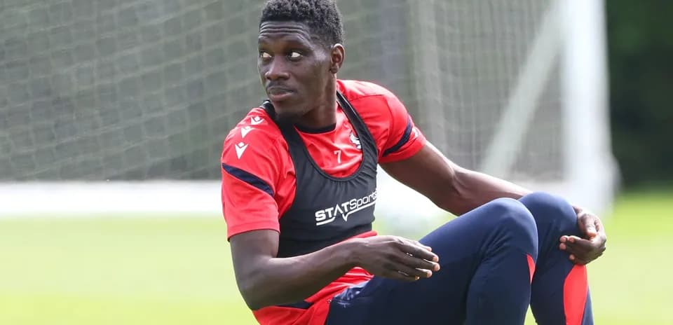 Player sitting on training pitch during practice session