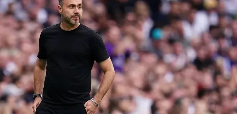 Coach walking on the sidelines during a match